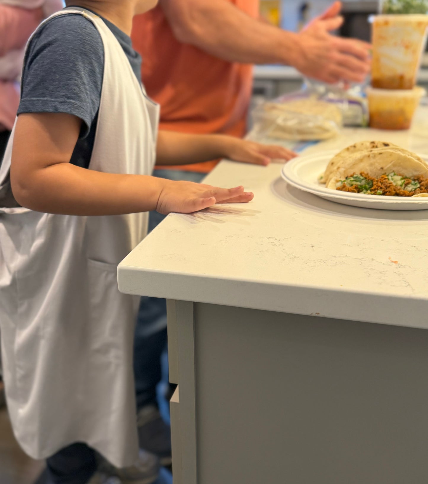 Tivi Armor - a cross-back, waterproof apron crafted from bamboo fabric